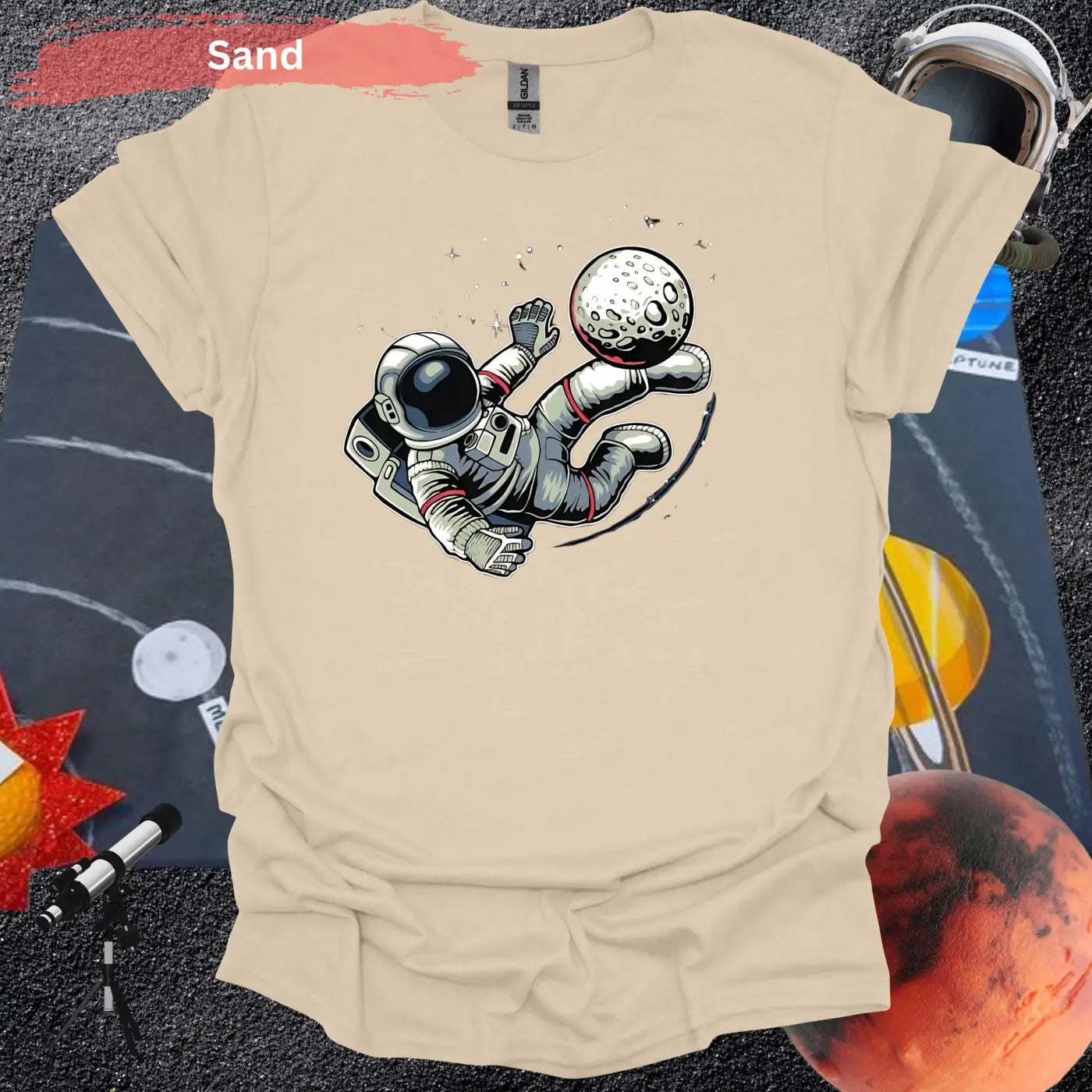 Astronaut Kicking Moon T-shirt - S / Sand - Physical Item