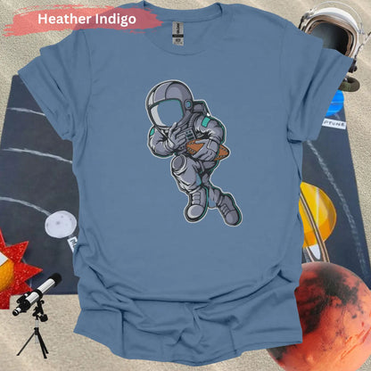 Astronaut Playing Football T-Shirt - S / Heather Indigo - Physical Item