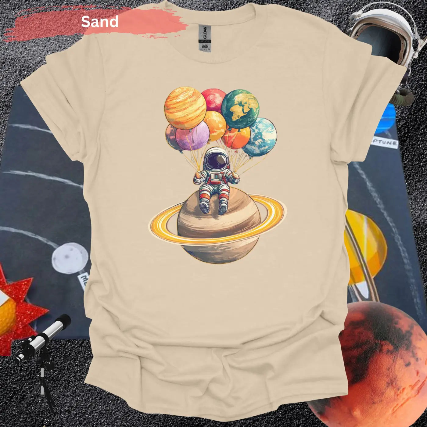 Astronaut Chilling with Planet Balloons T-shirt - S / Sand - Physical Item