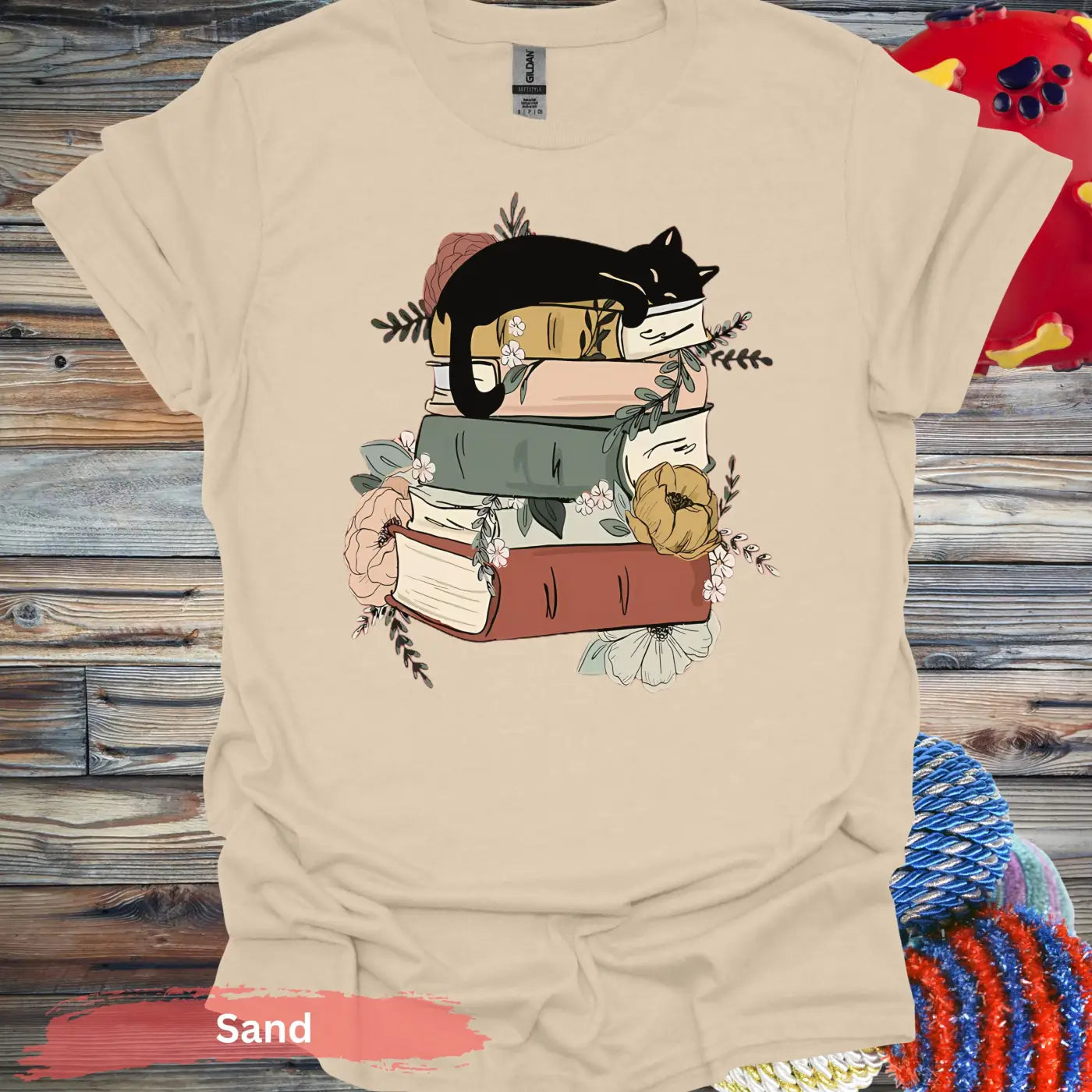 Cat Sleeping on Books and Flowers T-Shirt - S / Sand - Physical Item