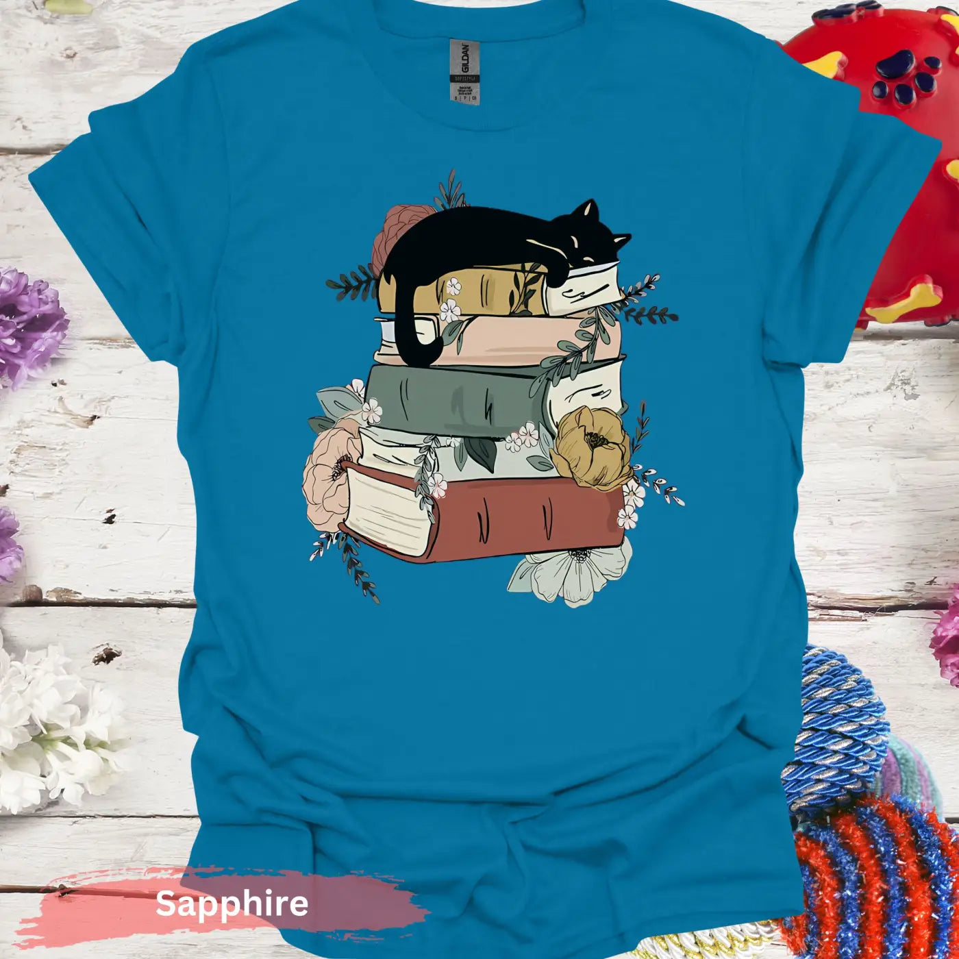 Cat Sleeping on Books and Flowers T-Shirt - S / Sapphire - Physical Item