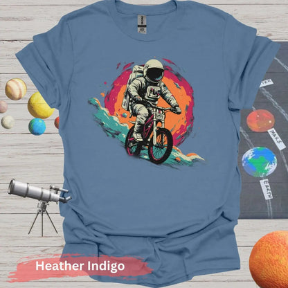 Cosmic Cyclist: Astronaut Biking Adventure T-Shirt - S - Unisex / Heather Indigo - Physical Item