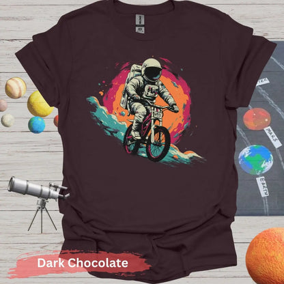 Cosmic Cyclist: Astronaut Biking Adventure T-Shirt - S - Unisex / Dark Chocolate - Physical Item