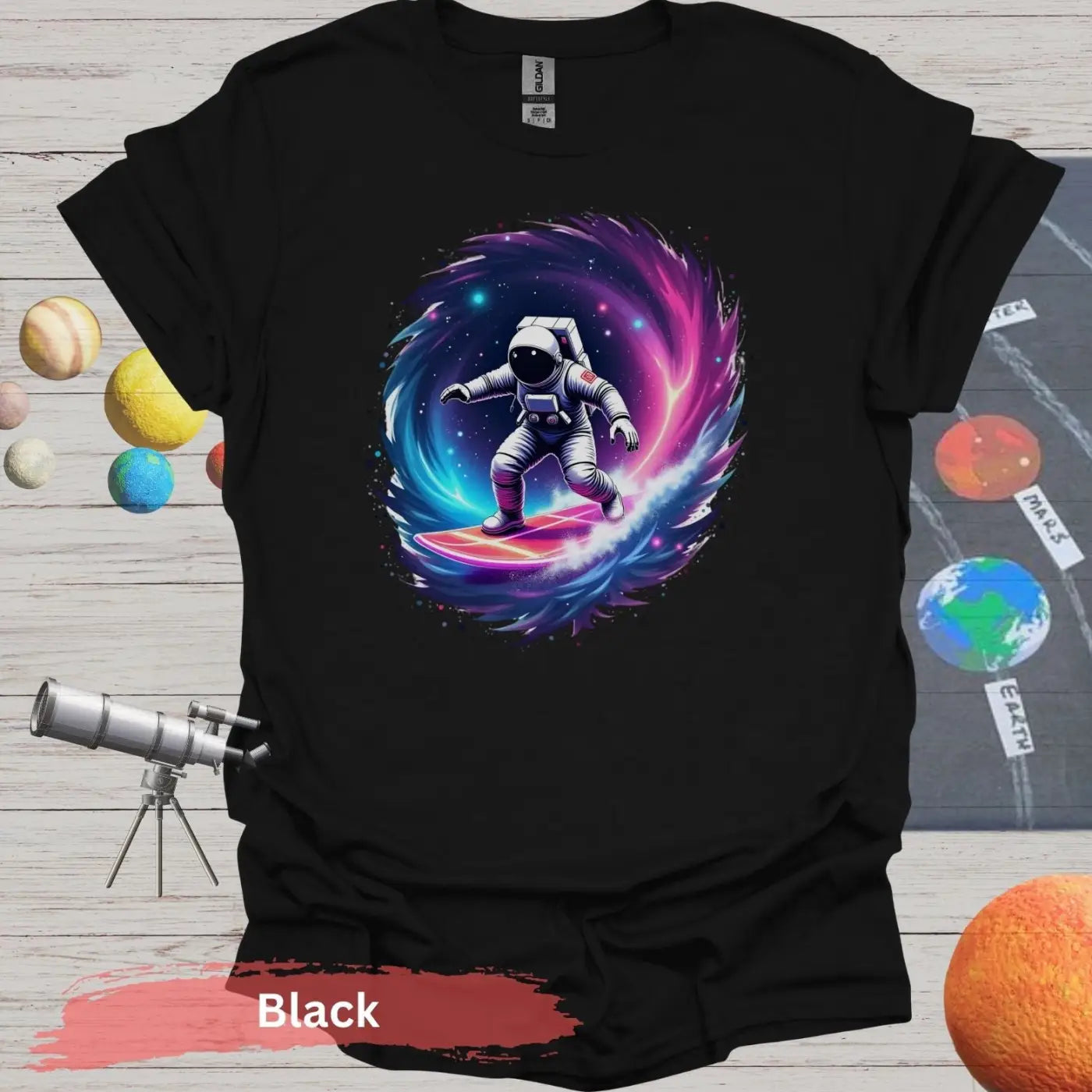 Cosmic Wave Rider – Astronaut Surfing Space Design T-shirt - S / Black - Physical Item