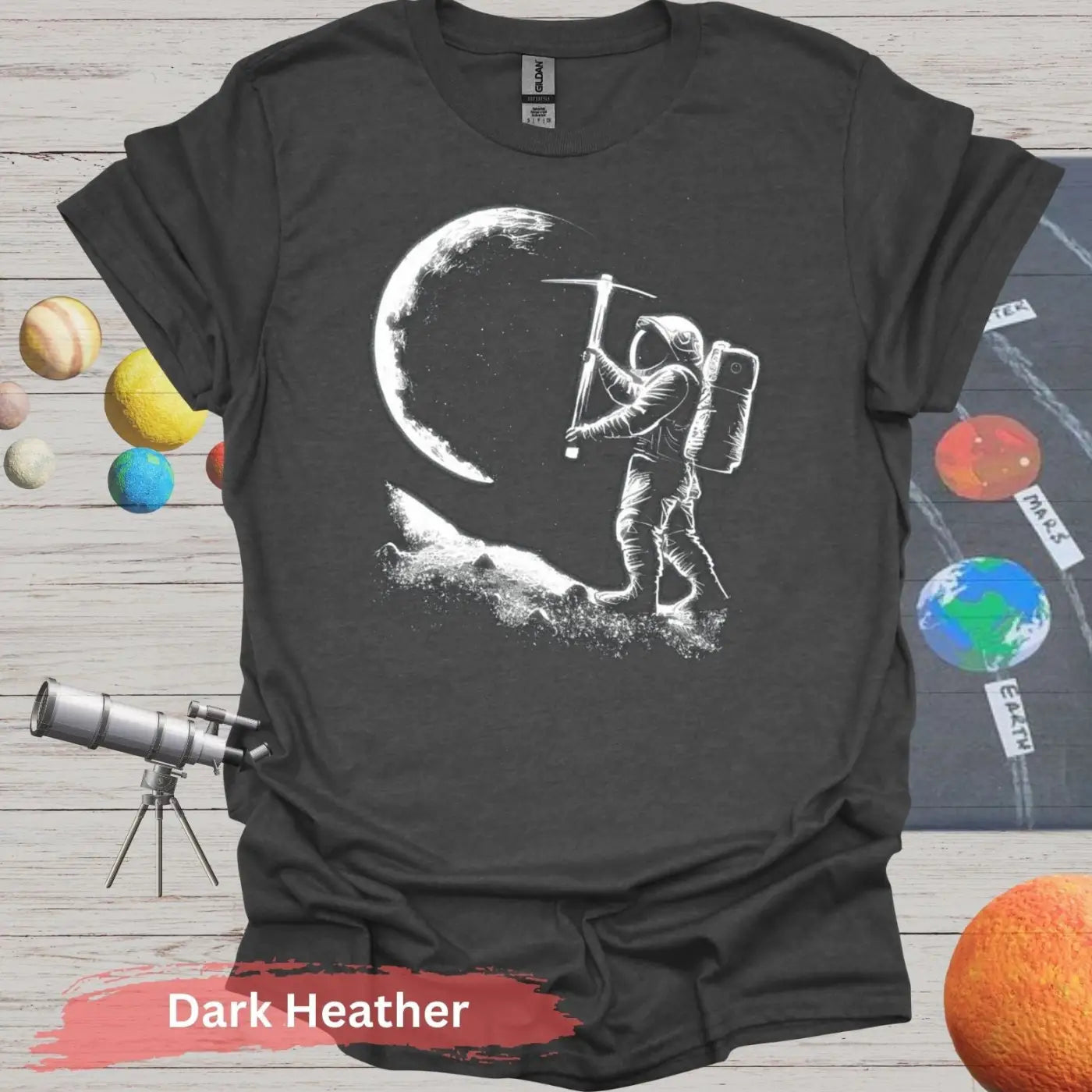 Lunar Miner: Astronaut Moon Chiseling T-Shirt - S - Unisex / Dark Heather - Physical Item