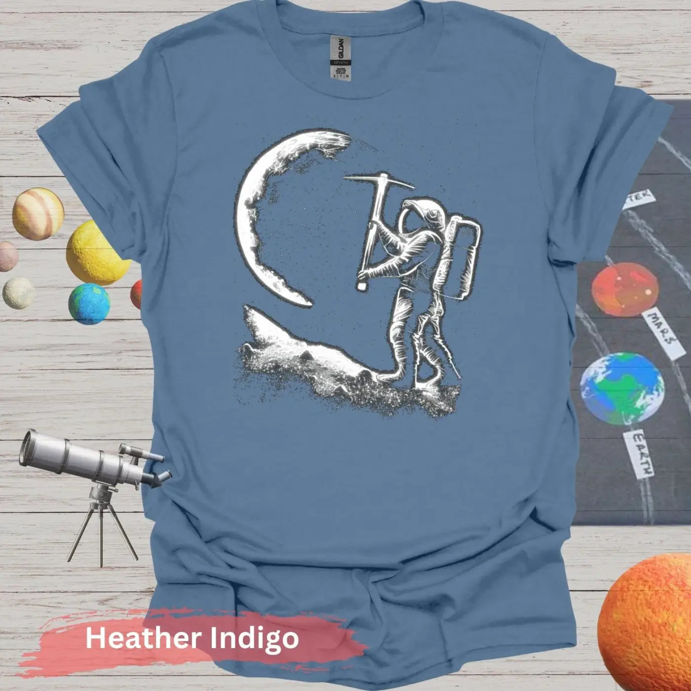 Lunar Miner: Astronaut Moon Chiseling T-Shirt - S - Unisex / Heather Indigo - Physical Item