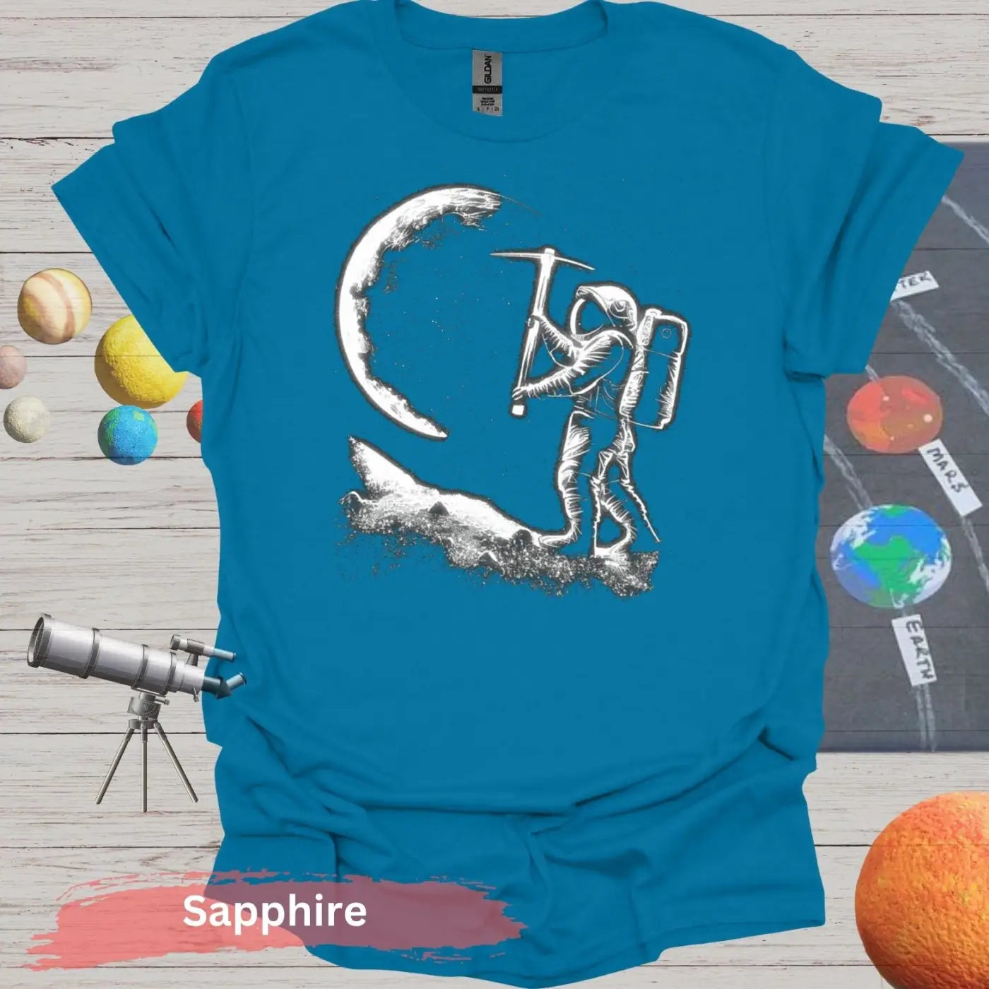 Lunar Miner: Astronaut Moon Chiseling T-Shirt - S - Unisex / Sapphire - Physical Item