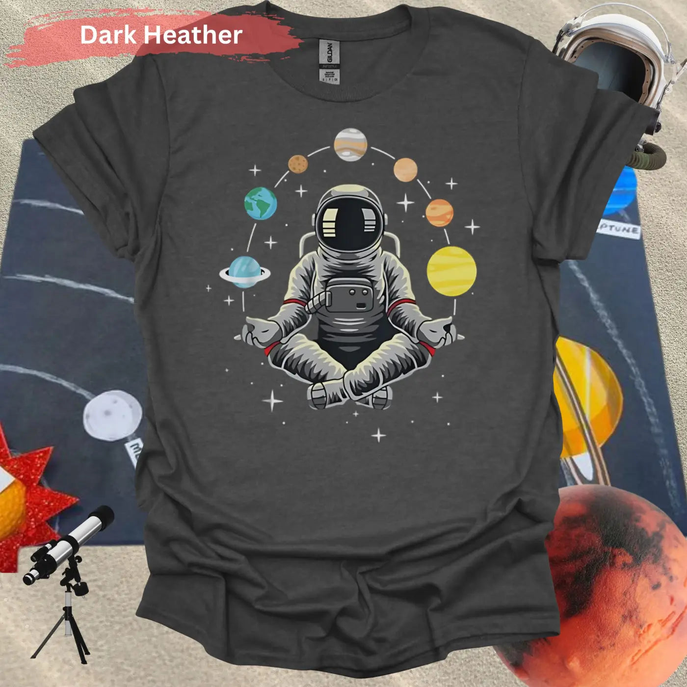 Meditating Astronaut Surrounded by Planets T-Shirt - S / Dark Heather - Physical Item