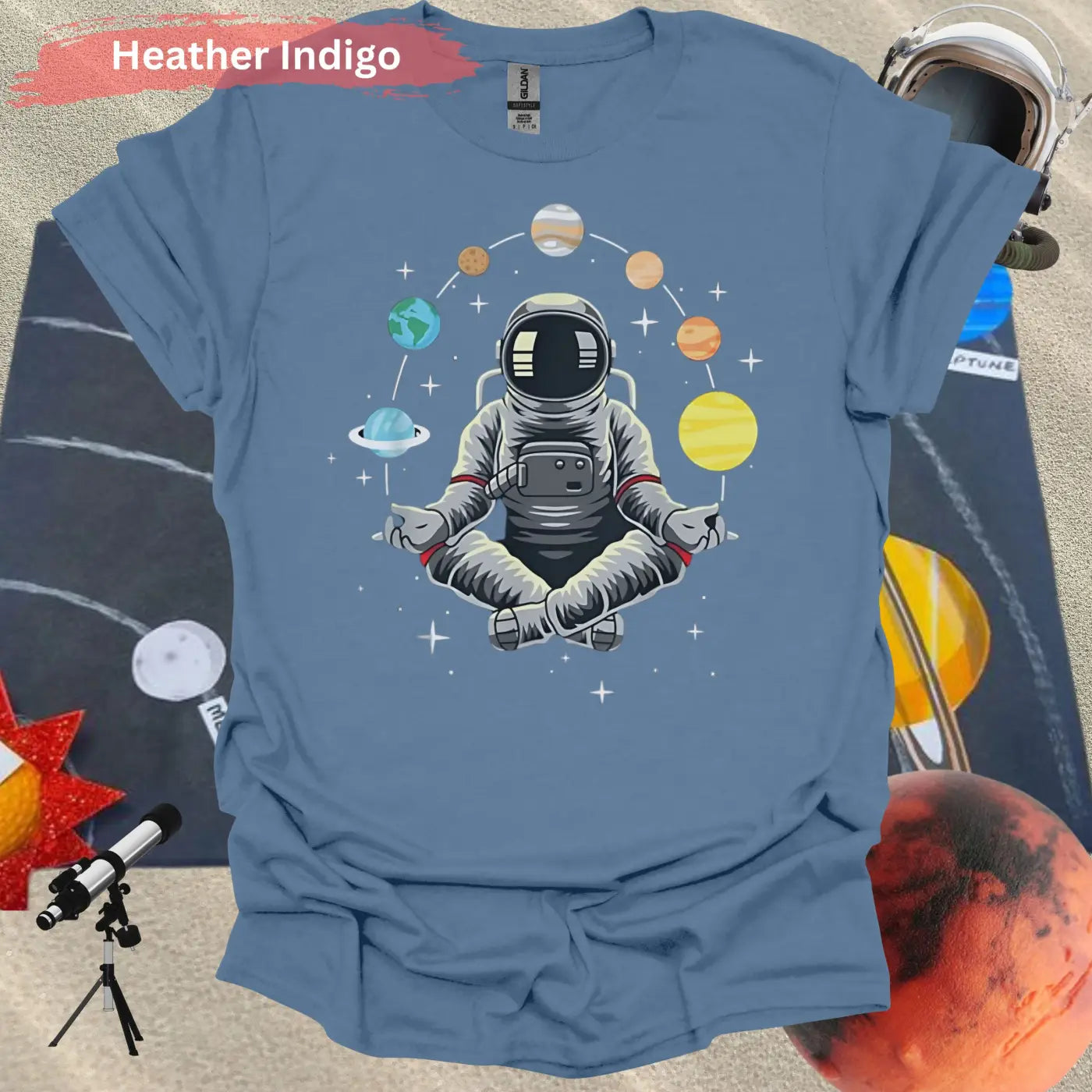 Meditating Astronaut Surrounded by Planets T-Shirt - S / Heather Indigo - Physical Item