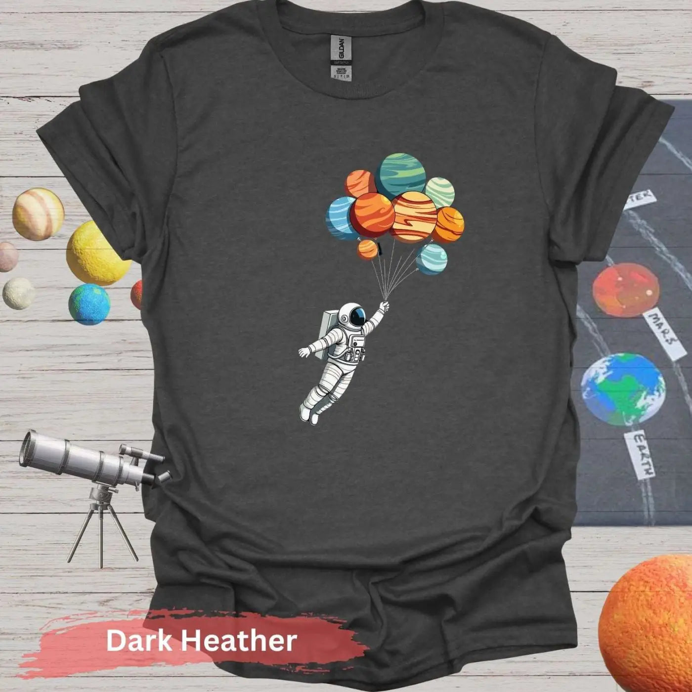 Planetary Dreams: Whimsical Astronaut Balloon T-Shirt - S / Dark Heather - Physical Item