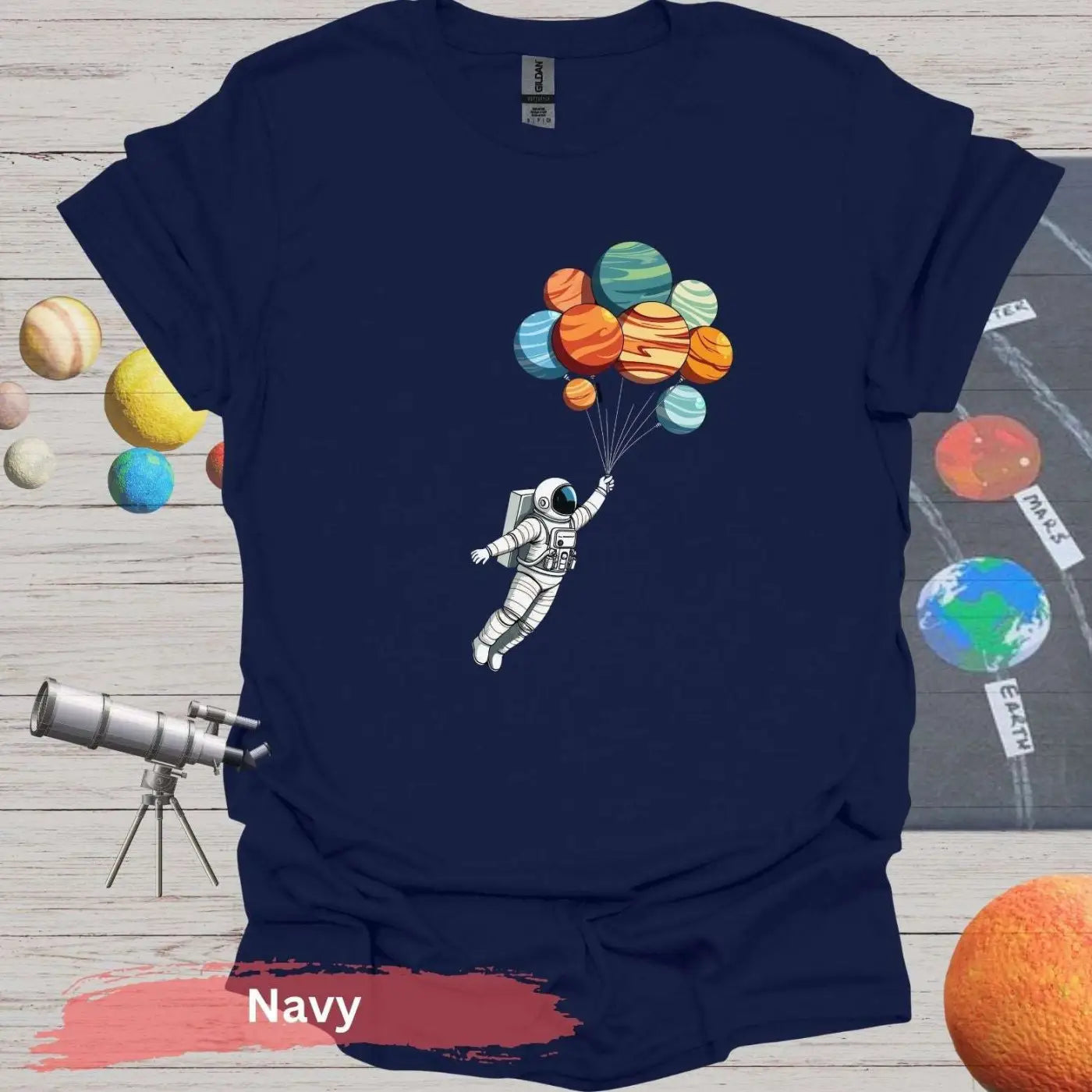 Planetary Dreams: Whimsical Astronaut Balloon T-Shirt - S / Navy - Physical Item