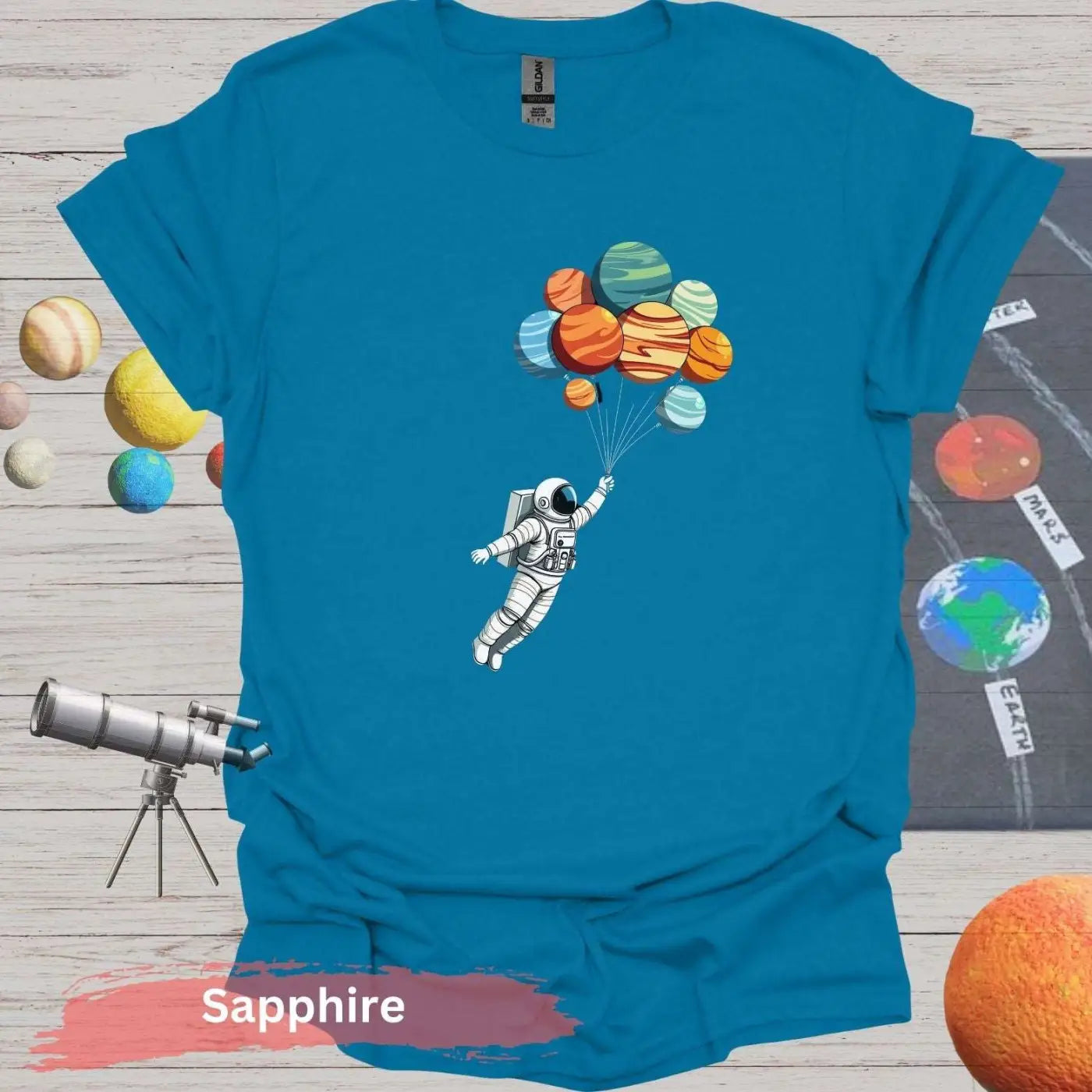 Planetary Dreams: Whimsical Astronaut Balloon T-Shirt - S / Sapphire - Physical Item